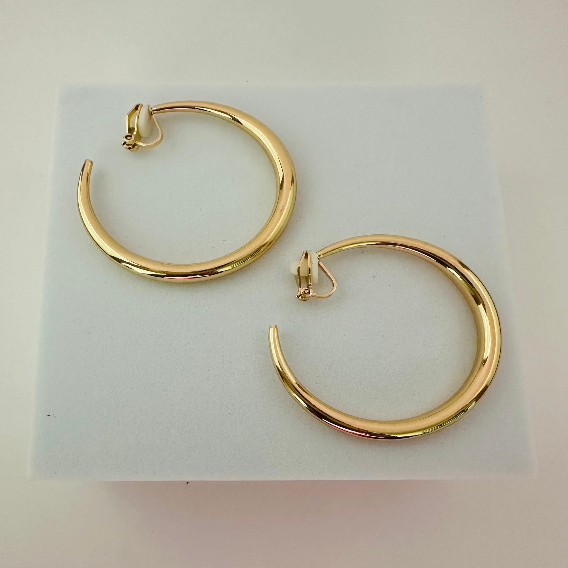 Affordable Alloy gold clip on hoop earrings, weight  .60oz .