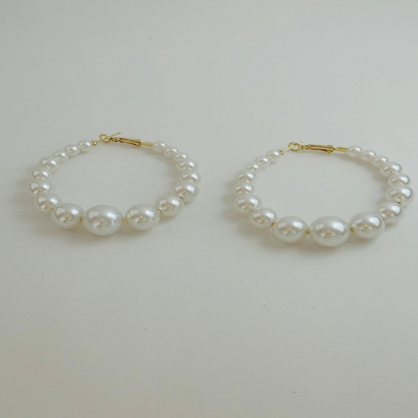 Pearl Hoop Earrings
Height 2.4 in
Width 2.36 in
Weight 0.741 oz