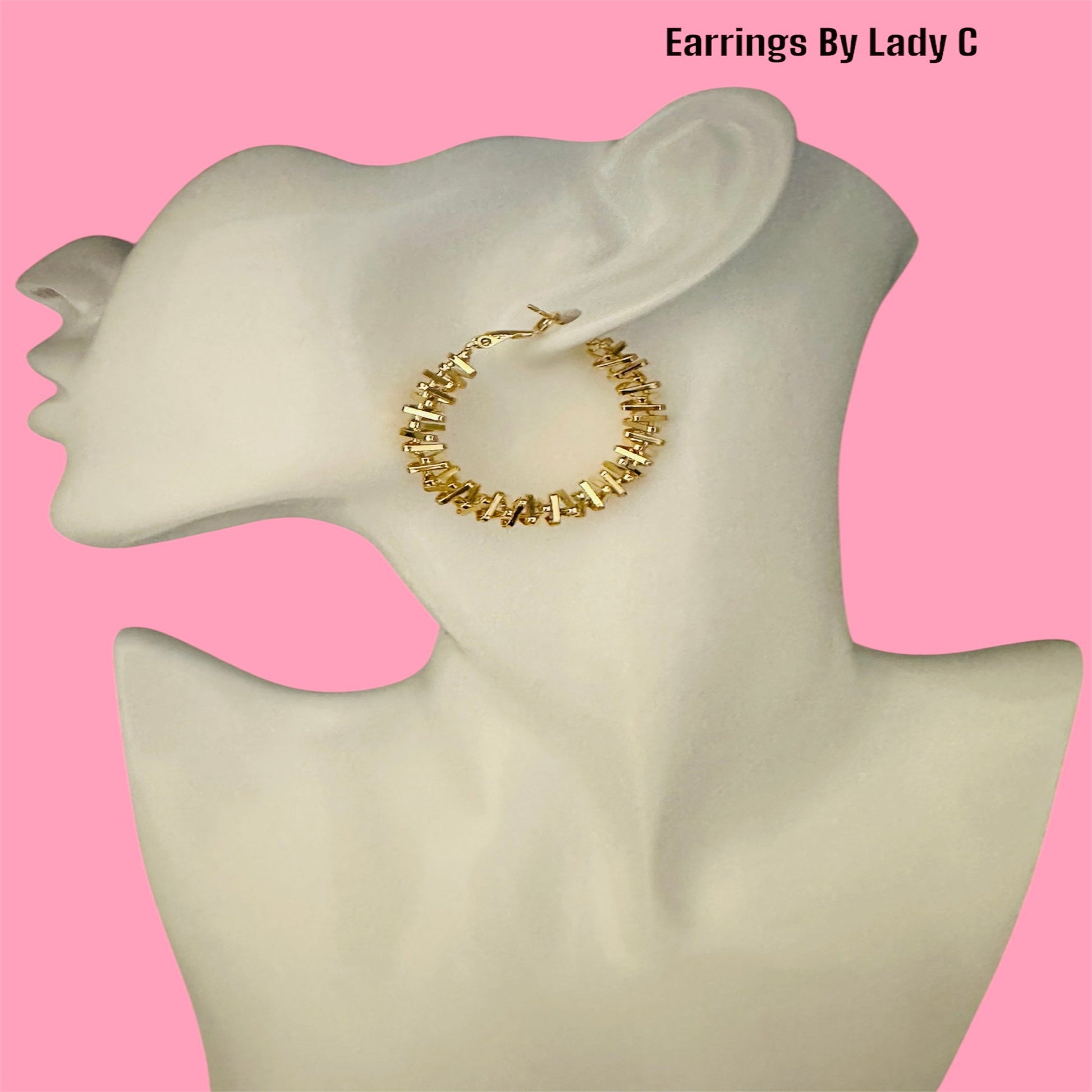 Elegant gold titanium hoop earrings – lightweight, hypoallergenic, and stylish for any outfit.