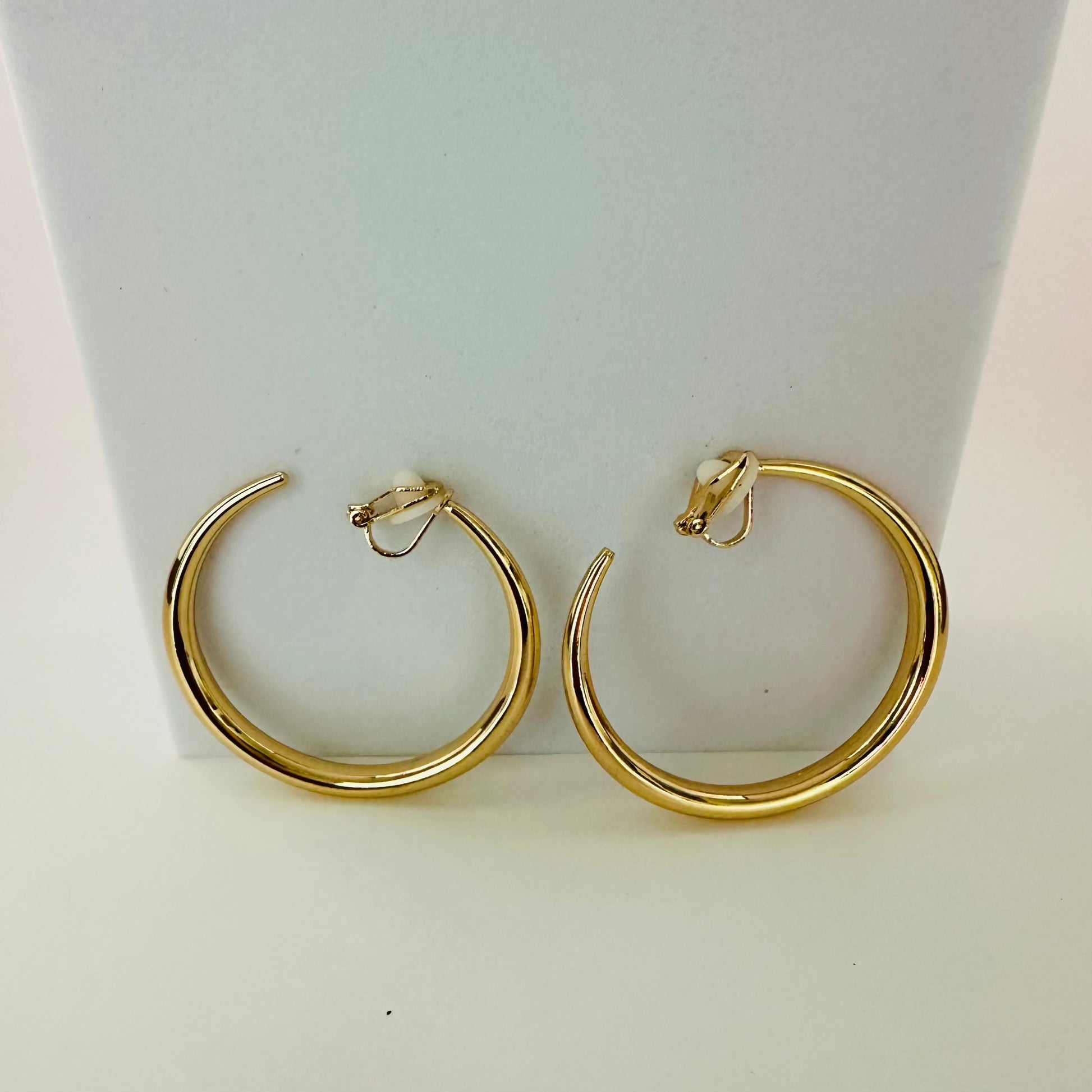 Affordable Alloy gold clip on hoop earrings, weight  .60oz .