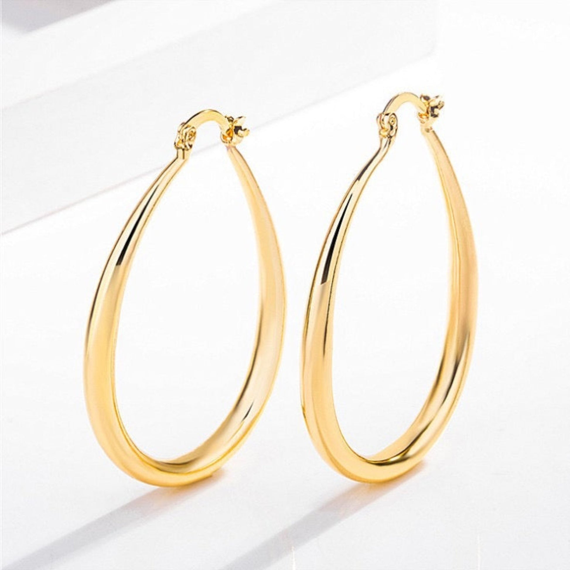 Small gold hoop earrings Iron 0.42 oz
2 inches length