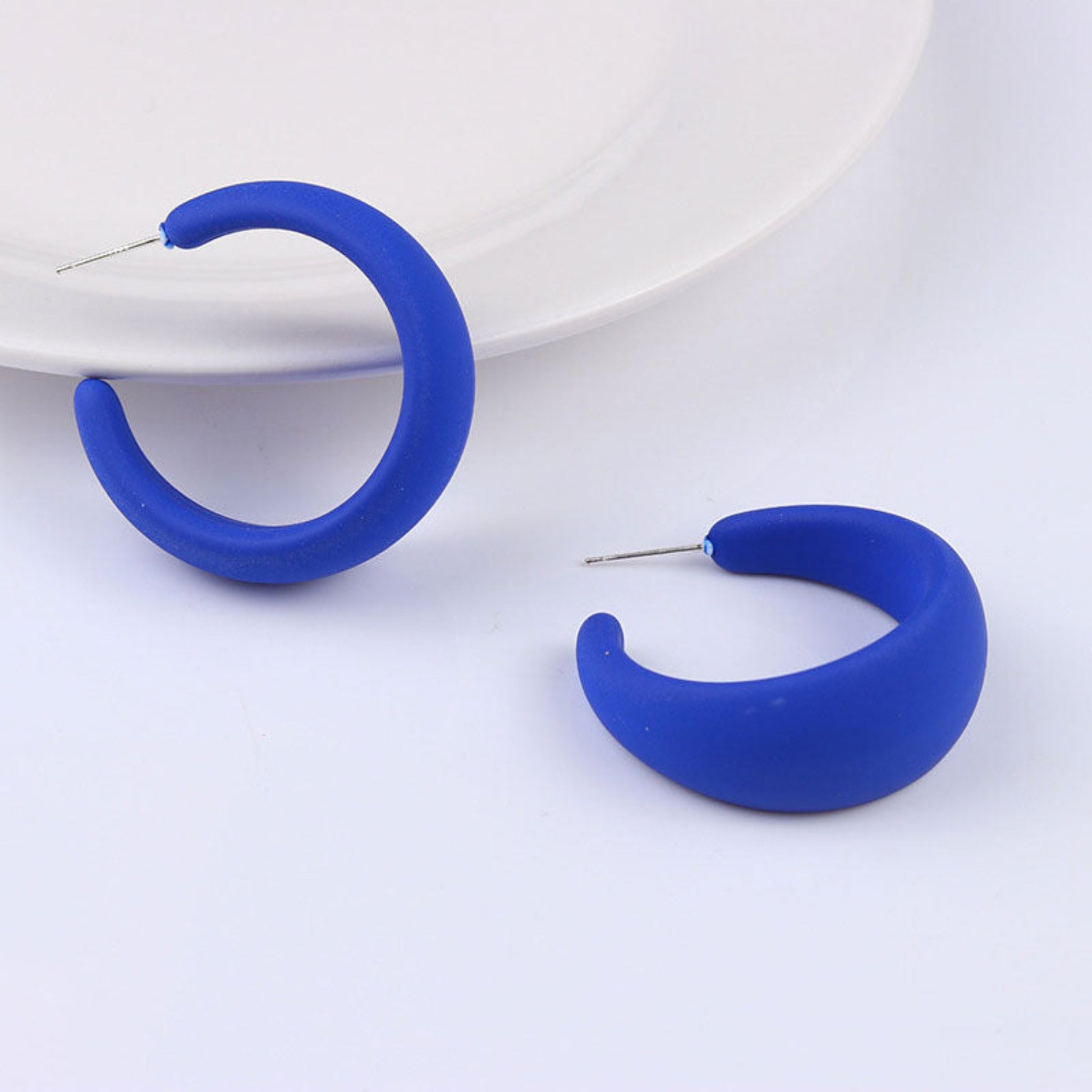 Acrylic  hoop earrings featuring a minimalist design, perfect for everyday wear.