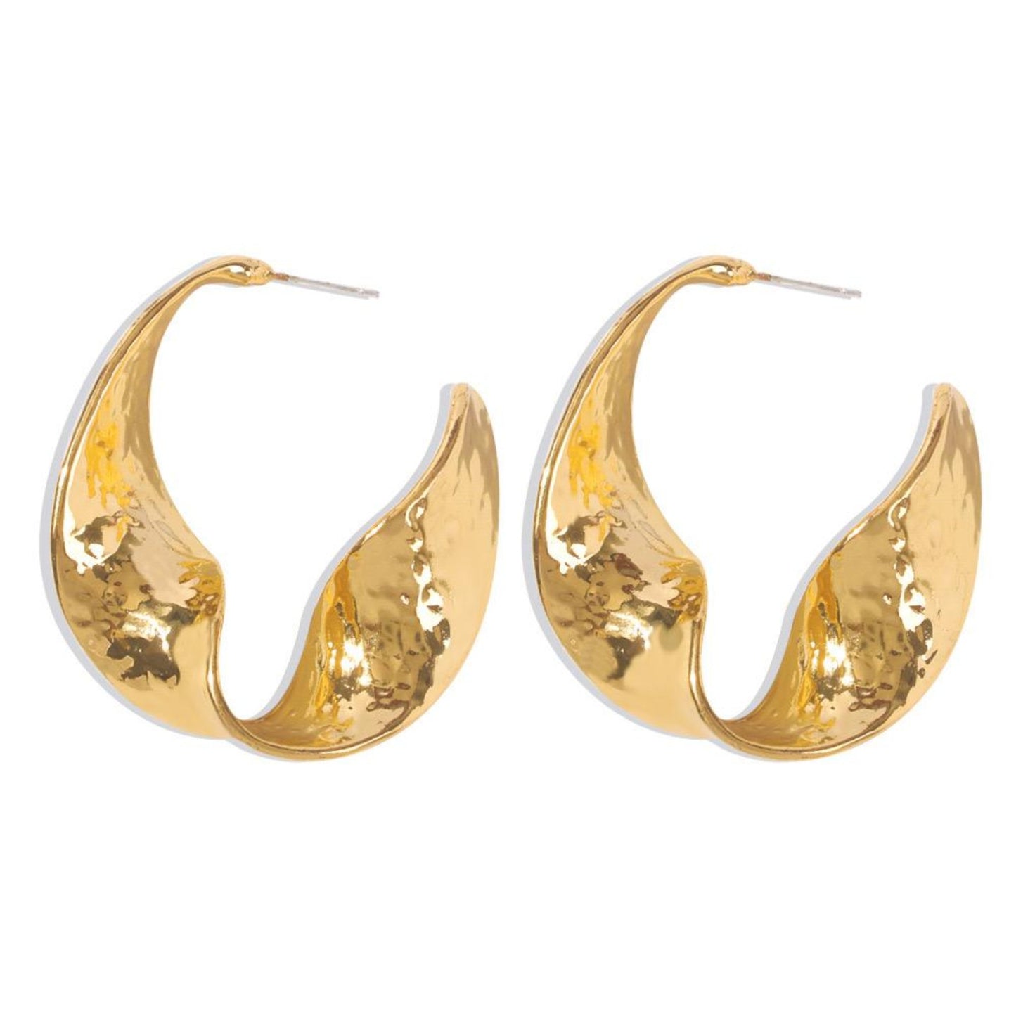 Close-up of elegant gold earrings with intricate detailing, perfect for formal and casual wear."